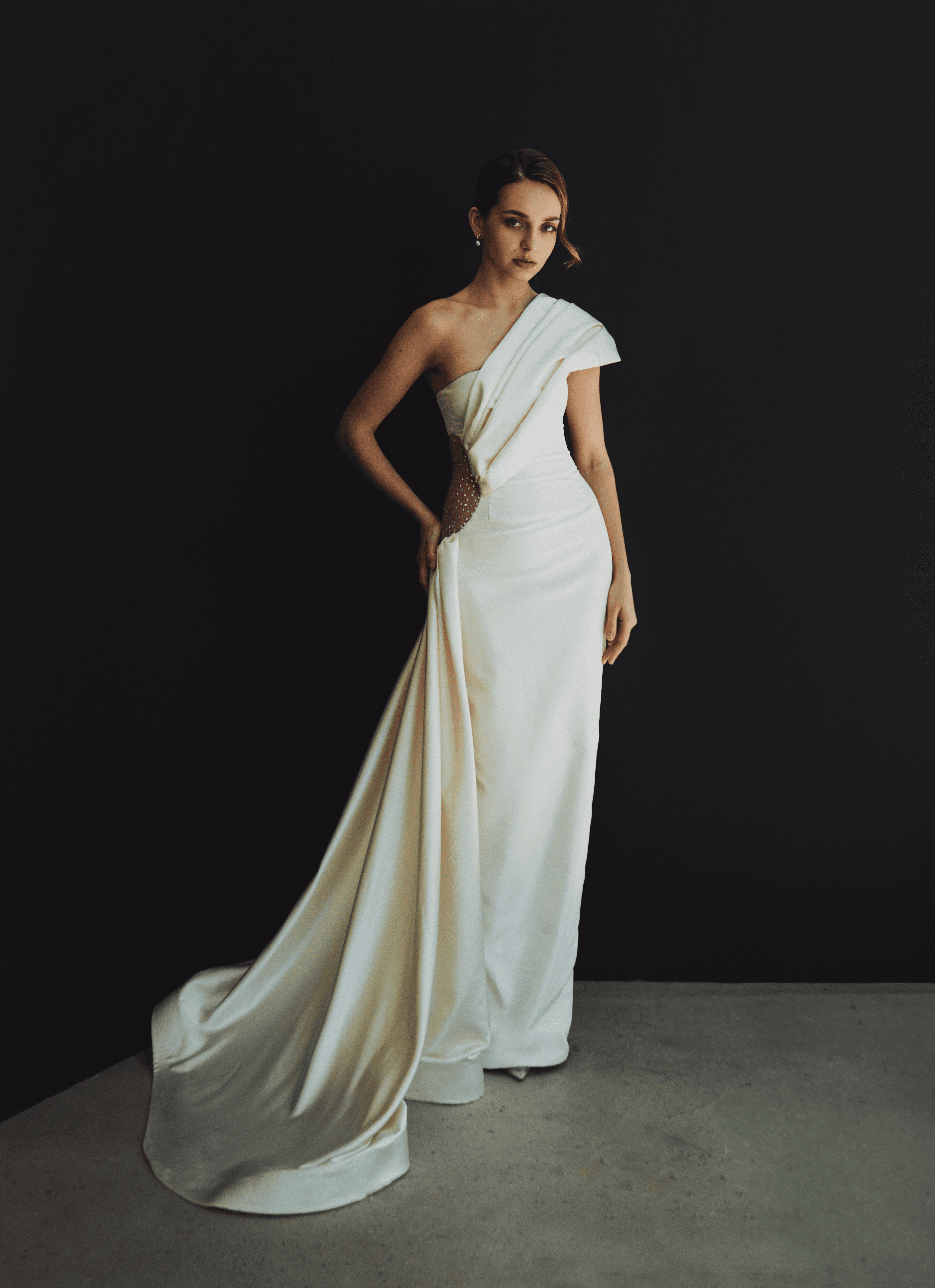 Ivory one-shoulder draped gown with long train